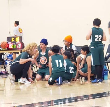 Basketball coach giving instructions during a match